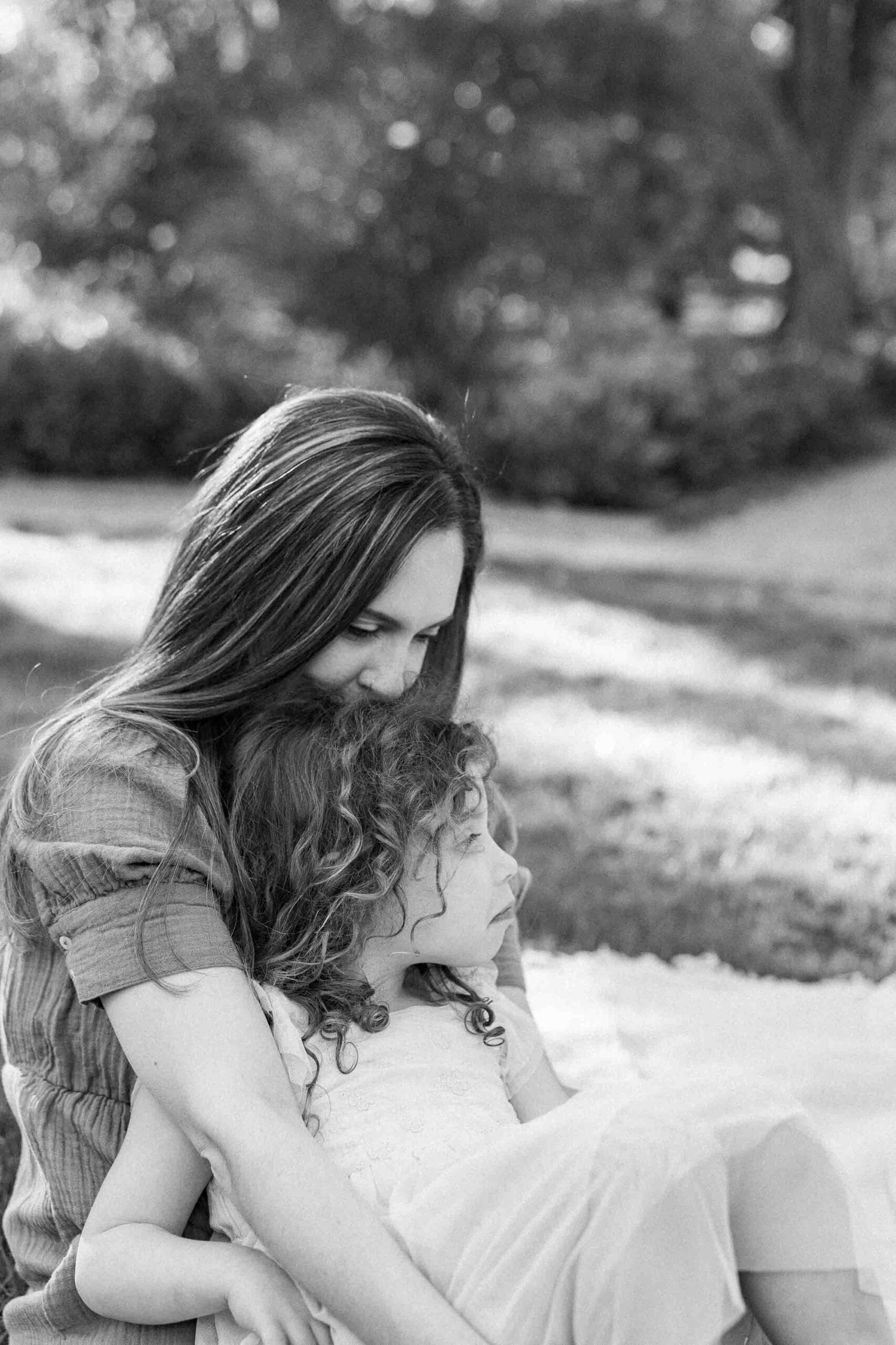 Sweet photo of mom kissing daughters head