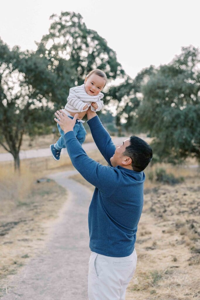 Dad throwing his son up in the air at Arastradero Preserve in Palo Alto