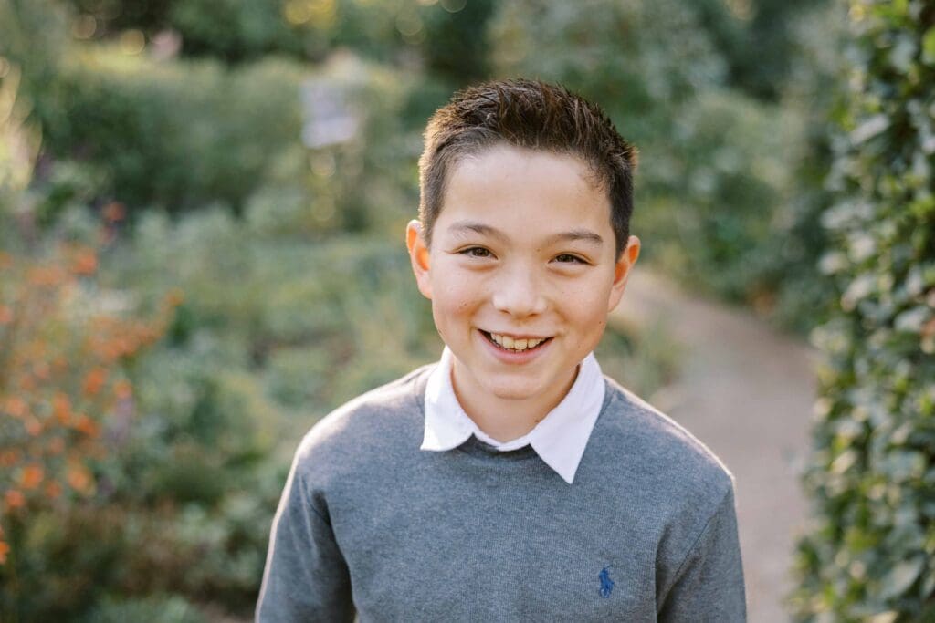 Kid smiling at camera at Filoli in Woodside, California