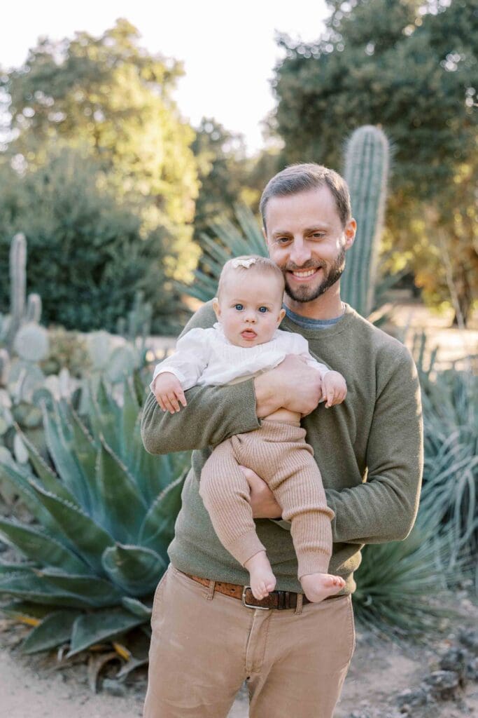 Dad holding his daughter at Arizona Cactus Garden in Palo Alto