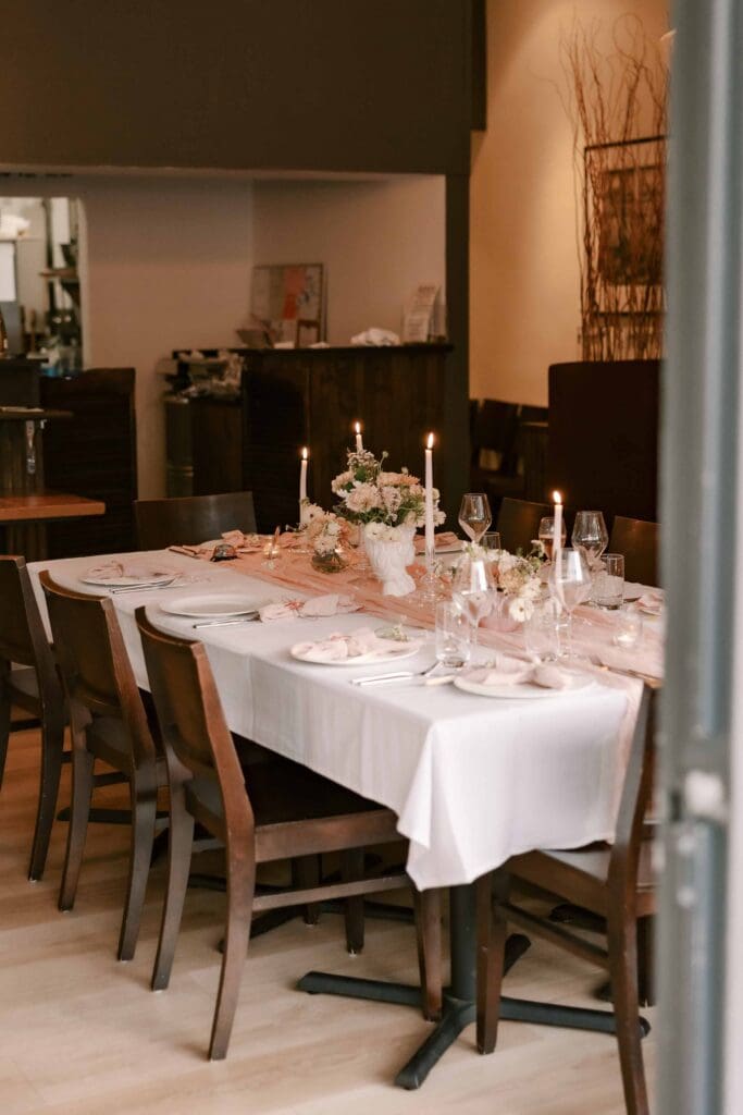 Door opening to an intimate table setting at Thyme Palo Alto for a Serendipity by Einat dinner