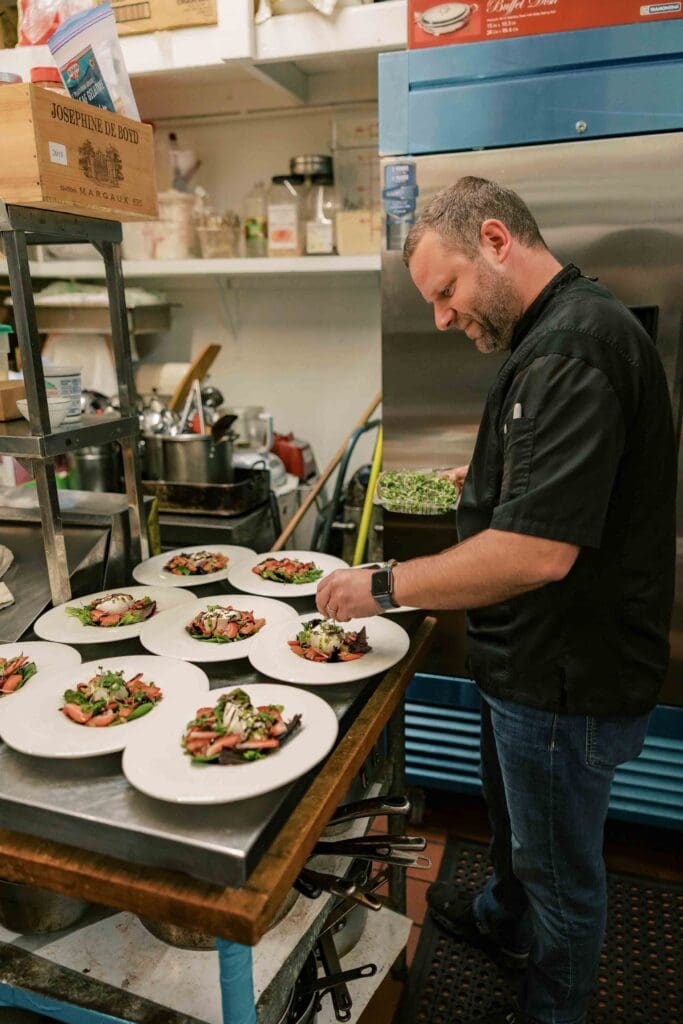 Chef Julien preparing a strawberry balsamic salad